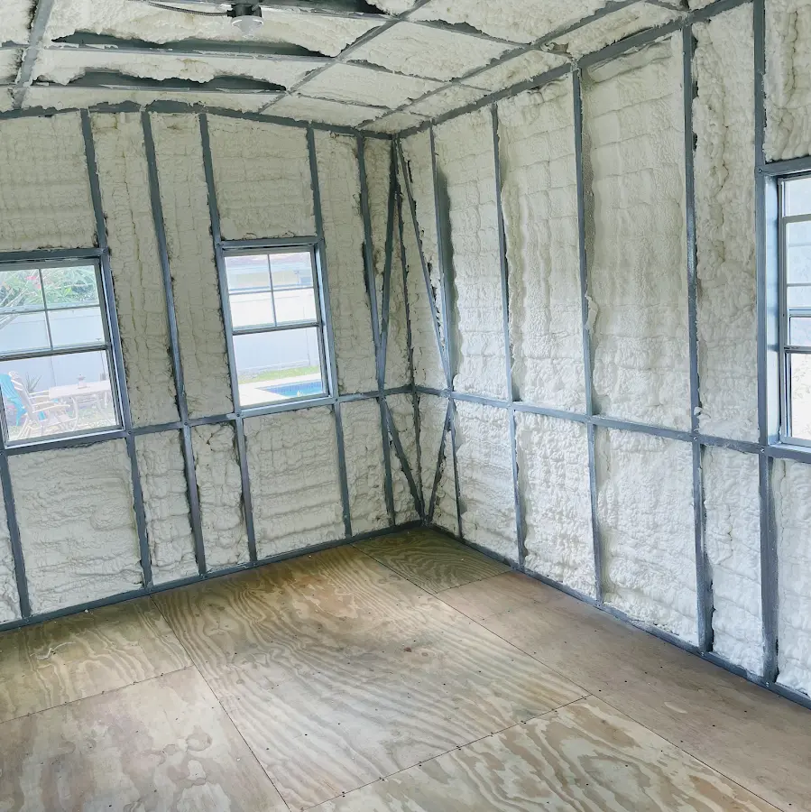 Closed-cell spray foam insulation applied to wall cavities in a residential project in West Perrine